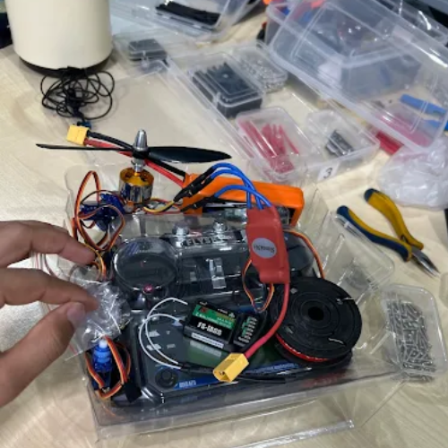 FlySky receiver and BLDC motor with ESC displayed on RoboSaki office table.