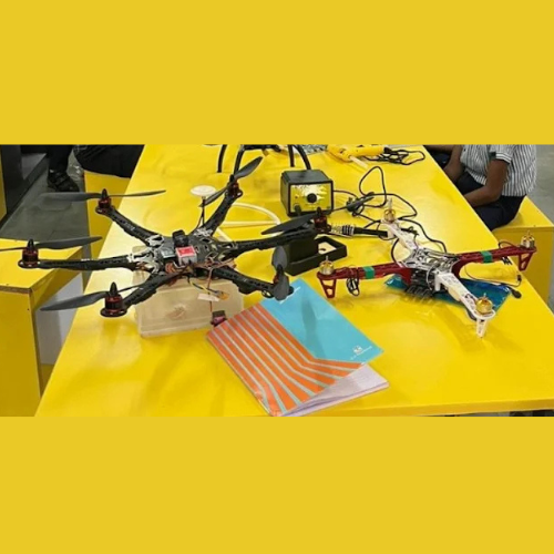 Drone placed on a yellow table.