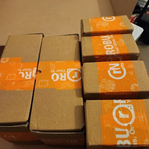Stacked cardboard boxes secured with Robu tape